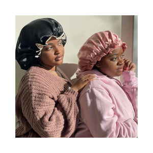 Artis Styling ladies wearing the Artis Styling Satin Adjustable bonnet in Creme and Black and Blush